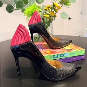 Michael Kors high-heeled pumps with a bold, fashion-forward design.